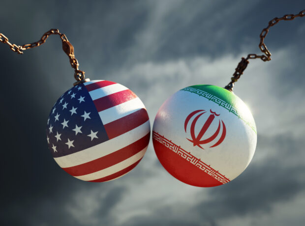 image-wrecking-balls-textured-with-american-and-iranian-flags-over-dark-stormy-sky